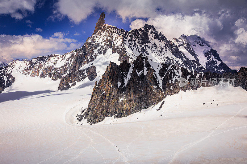 Dent du Géant, Mont Blanc Massif and mountaineers team on glacier – Italian alps side